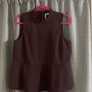 ELLE blouse very pretty, fits beautiful. Color is burgundy zippered on the back.